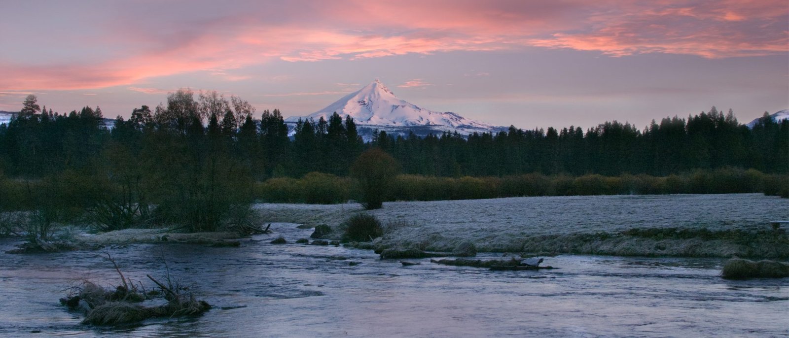 The Metolius River at sunrise with Mount Jefferson in the distance